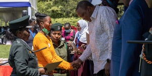 President Uhuru Kenyatta speaks with an inmate from Lang'ata Women Prisons at State House on Friday, May 13, 2022.