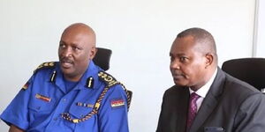 The former Inspector General of Police, Hilary Mutyambai (left) and, the former DCI boss, George Kinoti.