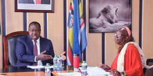 Interior CS Fred Matiangi (left) and his Industrialisation counterpart  Betty  Maina during a meeting