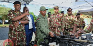 Interior CS Kithure Kindiki (center), Deputy Inspector General Noor Gabow (left) and other officials on Friday, November 25, 2022