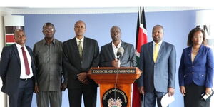 Isiolo Governor Mohammed Kuti (speaking) and Health CS Mutahi Kagwe (second right) among other leaders at a past press conference.