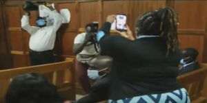 Private detective Jane Mugo filming journalists in court 