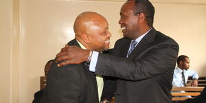 Jeff Koinange,(right) hugs political analyst Tony Gachoka when the two met at Milimani on June 5, 2015.