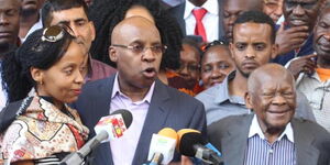  Jimi Wanjigi (centre) addresses a press conference on October 18, 2017, as his fater Maina Wanjigi (right), and his wife Nsinza Wanjigi (left) look on.