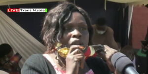 A woman speaks at the funeral of athlete Ben Jipcho on Friday, July 31