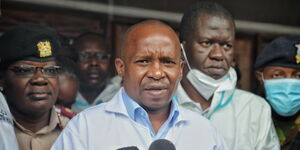 Interior CS Kithure Kindiki (centre) addresses the media with government pathologist Johansen Oduor (right) looking on in Malindi District Hospital in Kilifi County on May 1, 2023.