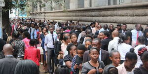 A photo of jobseekers queuing on Wabera Street, Nairobi, waiting to be interviewed by The Sarova Stanley on May 26, 2018. 