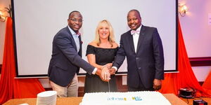 From Left: Tell Em's, Joel Chacha (General Manager) Elizabeth Cook (Managing Director) CS Mutahi Kagwe (Chairman) at the firms 2Oth anniversary in November 2019