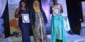 Citizen TV journalists Raquel Muigai (L) and Agnes Oloo (R) during the 2022 African Climate Change and Reporting (ACCER) Award ceremony