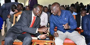 Deputy President William Ruto consults with Migori Governor Okoth Obado at Nyabisawa in Migori County on September 2020.