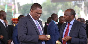 Attorney Genetral Justin Muturi (left) and Chief of Staff Felix Koskei converse moments before the launch of the Hustlers Fund at the Green Park Terminus on November 30, 2022. 