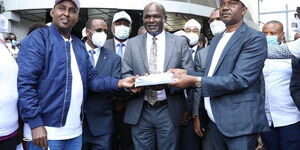 Suna East MP Junet Mohamed, IEBC Chair Wafula Chebukati and BBI Secretariat Co-Chair Dennis Waweru submit signatures at IEBC headquarters on December 10, 2020