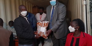 Education PS Julius Jwan overseeing the distribution of KCPE exam papers in Homabay County on Monday, March 7.