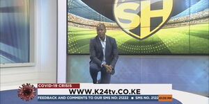 K24 sports presenter Tony Kwalanda kneels during a broadcast on May 2, 2020