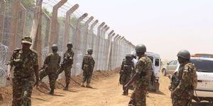 Kenya Defence Forces (KDF) soldiers inspect the security fencing at the Kenya-Somali border on February 21, 2017