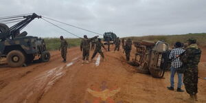 KDF officers save an overturned pick-up along Garissa-Hola Road