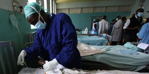 A doctor carrying out tests at the Kenyatta National Hospital.