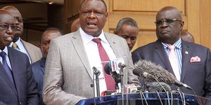 From left: Education PS Belio Kipsang, KESSHA Chairman Kahi Indimuli, and Education CS George Magoha address a press conference at Kenya Institute of Curriculum Development, on October 1, 2018