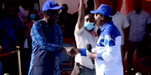 ODM party leader Raila Odinga and Wiper's Kalonzo Musyoka shake hands after Kalonzo endorsed him for the presidency at Jacaranda Grounds on Saturday, March 12, 2022