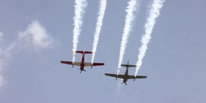 Kenya Air Force pilots perform a drill during the Uhuru Garden's Museum Air Show Festival in Nairobi on Saturday, May 28, 2022