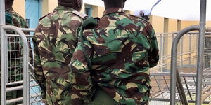 Kenya Police Officers inspecting a prison facility.