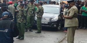 Kenya Police officers pictured at a crime scene.