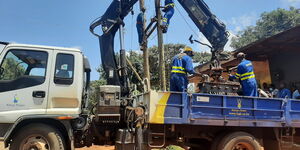 Kenya Power technicians installing a transformer in Kisumu County on April 5, 2022.