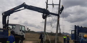 Kenya Power staff working on electricity lines at Soysambu Conservancy on February 22, 2021