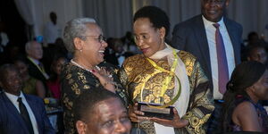 Kenya's First Lady Margaret Kenyatta (Left) and Lizzie Wanyoike pictured during the Ernst & Young Entrepreneur of the Year Awards on December 5, 2018.