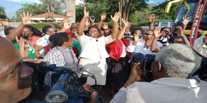 Kenya High School Principal, Mrs Flora Mulatya, leads teachers and students in celebrating 2019 KCSE results after 76 of their 315 students scored grade A