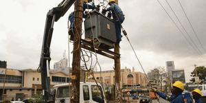Kenya Power employees attending to a faulty transformer