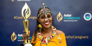 Kenyan nurse Anna Qabale Duba poses with the Aster Guardians Global Nursing Award held on Thursday, May 12, 2022 at Atlantis Hotel in the United Arab Emirates.