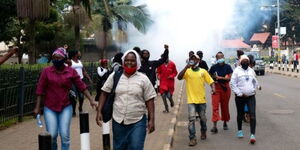 Protestors running from teargas during protests on June 9, 2020