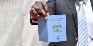 A file image of someone holding a Kenyan passport