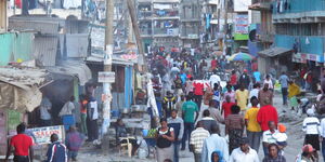 Kenyans at a street in Nairobi City's downtown area.