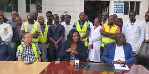 Keroche Breweries founder Tabitha Karanja (center) addressing the press.