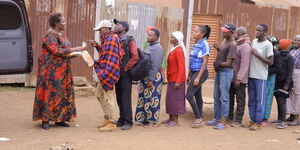 Kiambu Woman Representative Anne Wamuratha (left) donating bread and unga in Kiambu on Monday, January 23, 2023