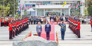 King Charles III (left) and President William Ruto pay respects at Uhuru Gardens' Tomb of the Unknown Warrior, commemorating lives lost in wars and Kenya's fight for independence on October 31, 2023. 