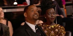 King Richards star Will Smith (left) and Lupita Nyong'o at the Oscars on Sunday, March 27, 2022.