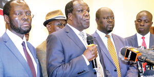 From left: Kisumu Governor Anyang’ Nyong’o, Council of Governor chairman Wycliffe Oparanya and Trans Nzoia governor Patrick Khaemba address the press in Nairobi on December 16, 2019.