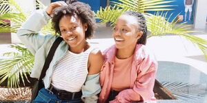 Belinda Joanna/Kobi (left) and her identical sister Linda Alexette/Tobi (right) pose for a photo in Nairobi in 2020