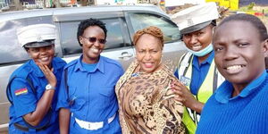 Detective Jane Mugo with police officers in a past event on June 15