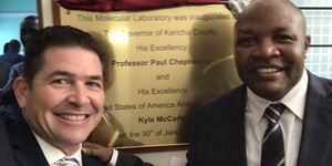 US Ambassador Kyle McCarter poses with Kericho Governor Paul Chepkwony after unveiling medical equipment in Kericho on January 30, 2020