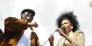 ODM leader Raila Odinga with the late Lady Maureen during a rally on September 7, 2014 in Kibra, Nairobi