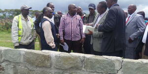 Laikipia East MP Anthony Mutahi (in striped shirt) during the inspection of a classroom under construction at Kariguini Secondary School in his constituency in 2015.