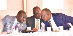 Left to right: President William Ruto talks to his deputy Rigathi Gachagua and Defense CS Aden Duale.