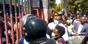 Legislators and police officers pictured outside the Nakuru Police Station on September 16, 2020.
