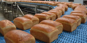 Loaves of bread being baked at a bakery