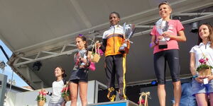 Kenyan athlete Lonah Nyabochoa (centre) scoops the first position in the 2022 Laus Half-marathon based in Italy. 