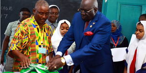  Education Cabinet Secretary, the Kenya National Examination Council (KNEC) Chairperson, Prof George Magoha supervises the opening of the container containing examinations papers, at the Coast Regional Coordinator's office